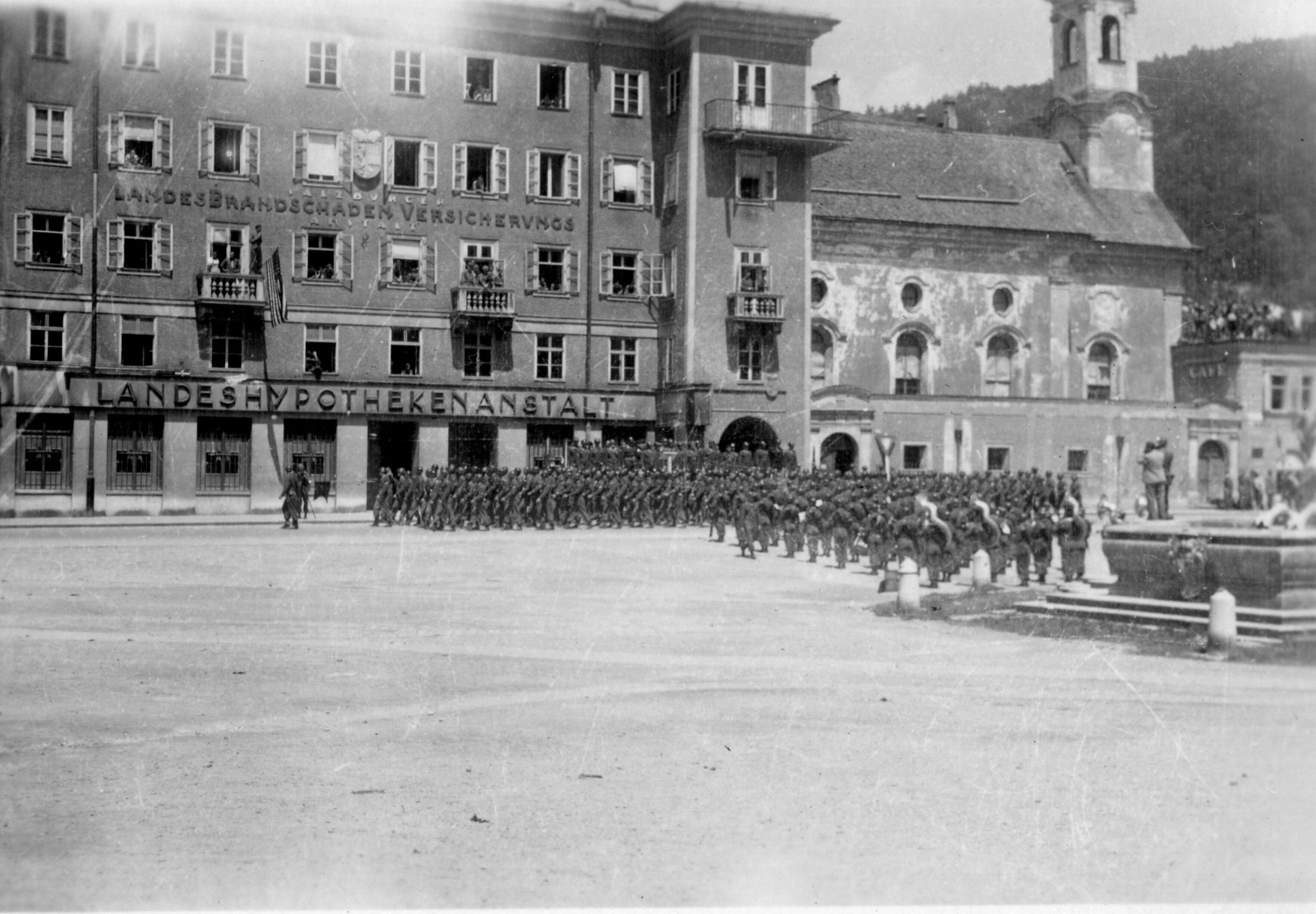 American troops of the 42nd Rainbow Division formed up in a Salzburg square on occupation duty, July 1945